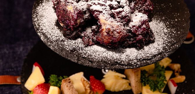 Blueberry Schmarrn is served on an attractively presented plate.