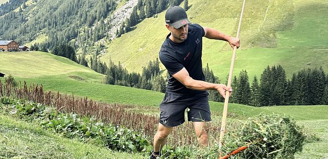 Johannes Strolz is raking his hay.
