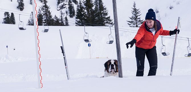 Ulrike Schlierenzauer points to the snow measurement station.