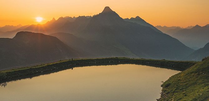 Sunset at Lake Steinmandl, with the distinctive Biberkopf visible in the background.