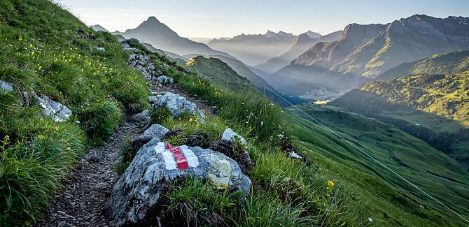 Hike to the Widderstein Hut at sunrise; the trail is well marked.