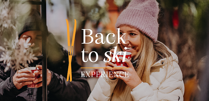Image for the „Back to Ski“ experience, with a woman drinking mulled wine in the background.