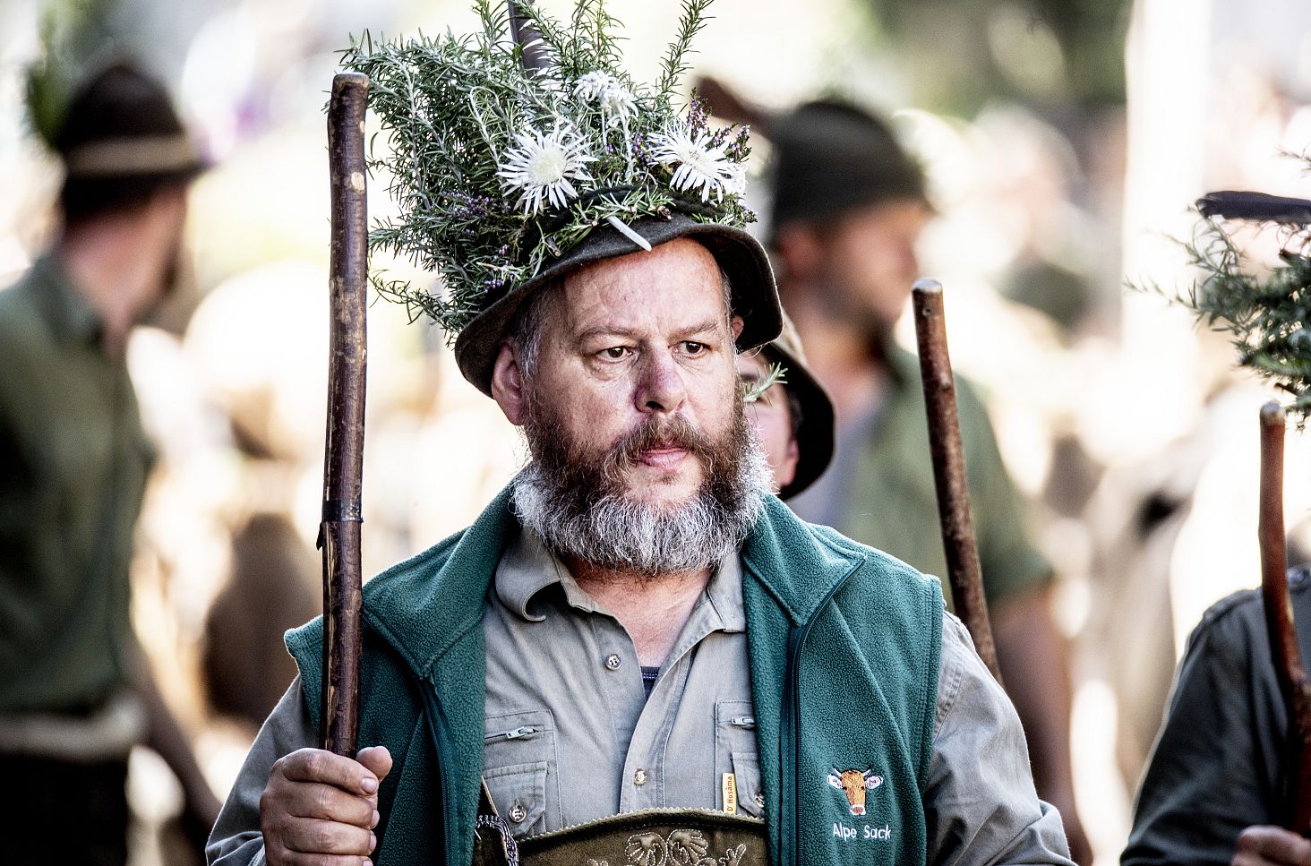 An alpine herdsman wearing a decorated hat.