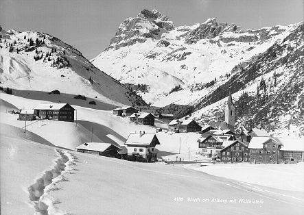 Historic photo of the village of Warth, entirely covered in snow.