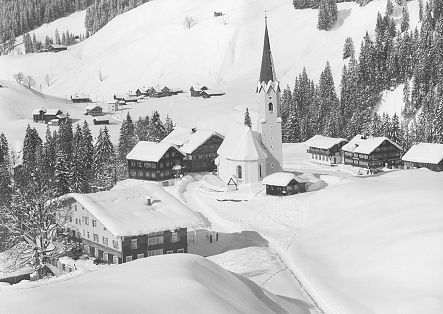 Historic image of Schröcken Heimboden, completely covered in snow.