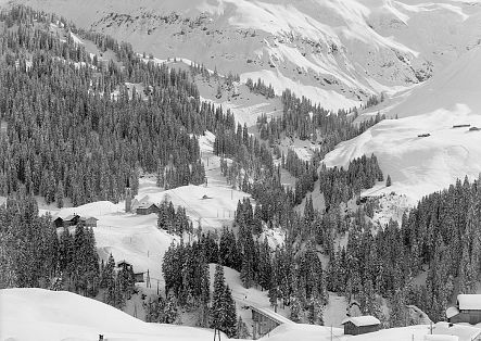 Historic image of Schröcken Oberboden, looking towards Tannberg Bridge and Heimboden, completely covered in snow.