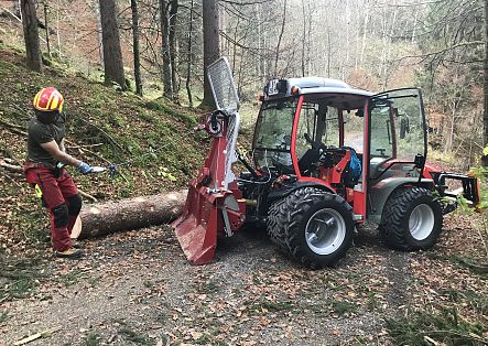 Johannes Strolz works with a winch during the timber work.
