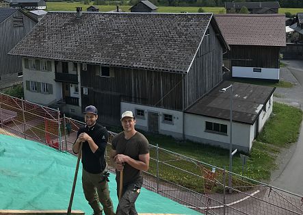 Johannes Strolz helps his brother-in-law with roofing the house.